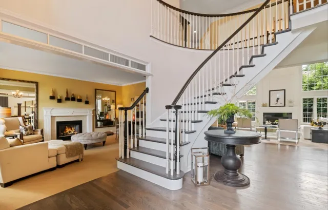 a view of entryway livingroom and hall with wooden floor