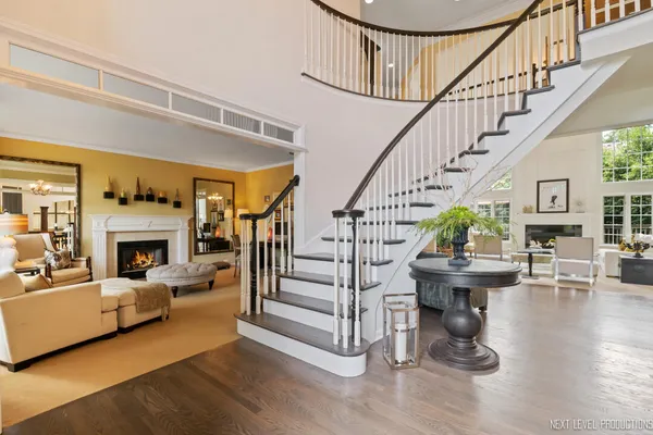 a view of entryway livingroom and hall with wooden floor