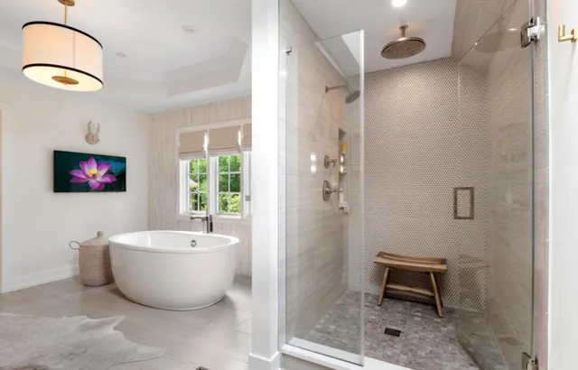 a spacious bathroom with a bathtub and a shower