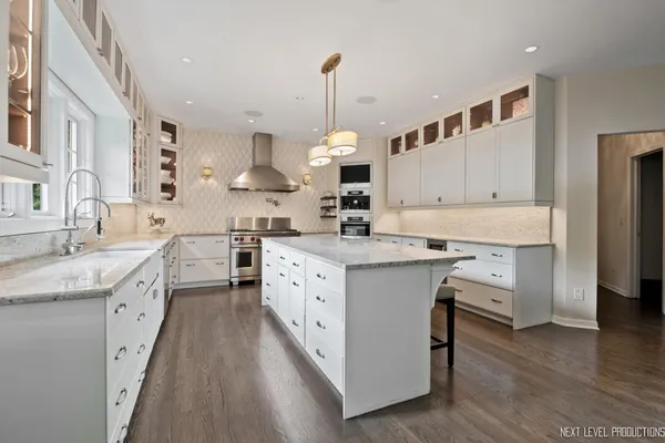 a living room with furniture and large windows