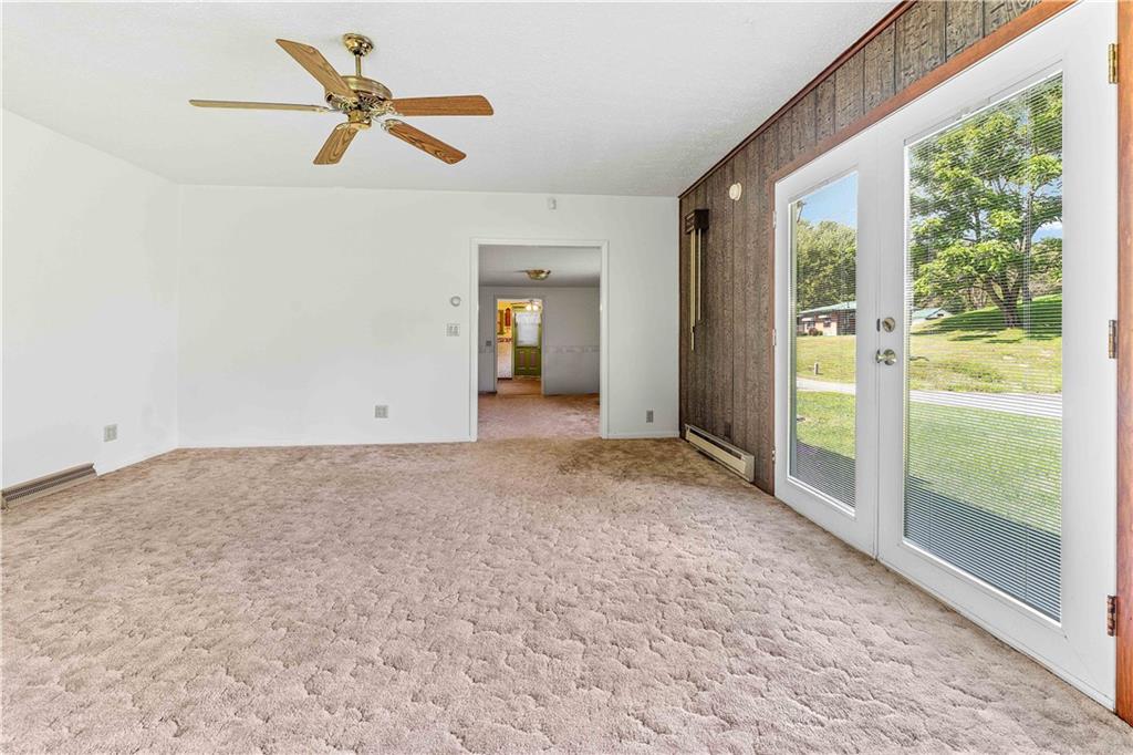200 Brown Hill Road Markleysburg, PA 15459 - Photo 24 of 35 a view of a livingroom with a ceiling fan and window