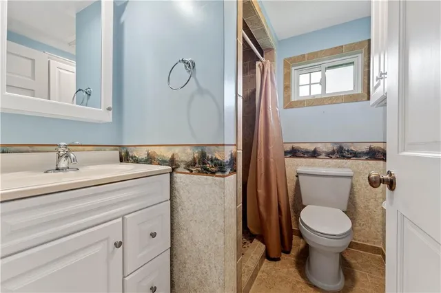 a bathroom with a sink a mirror and a shower