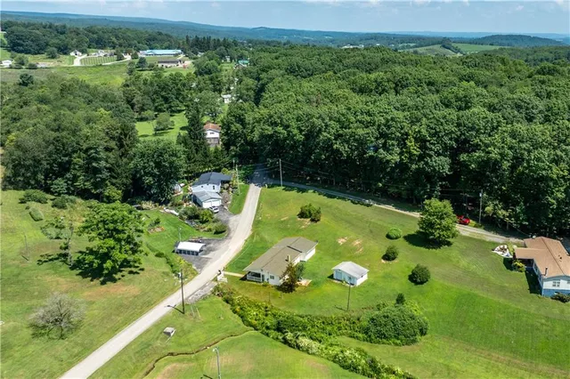 an aerial view of a golf course with street view