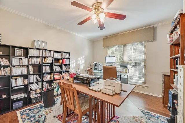 a workspace with furniture and a book shelf