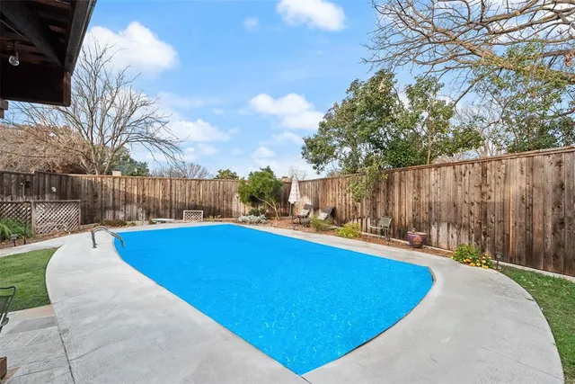 a view of outdoor space and swimming pool