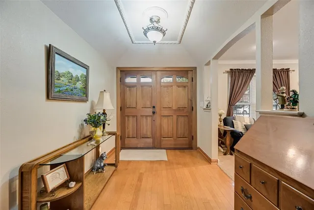 a view of an entryway with wooden floor