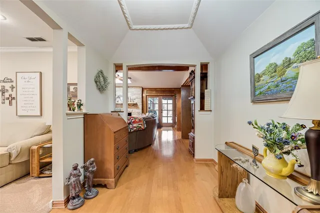 a living room with furniture a window and gym equipment