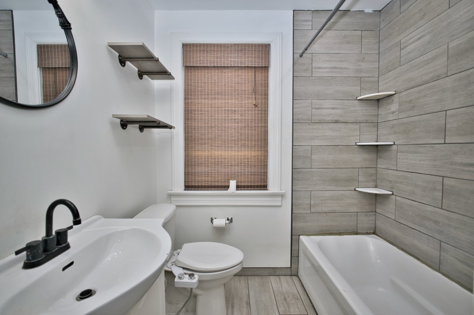 4122 Clinton Avenue Stickney, IL 60402 - Photo 14 of 44 a bathroom with a sink a toilet and bathtub