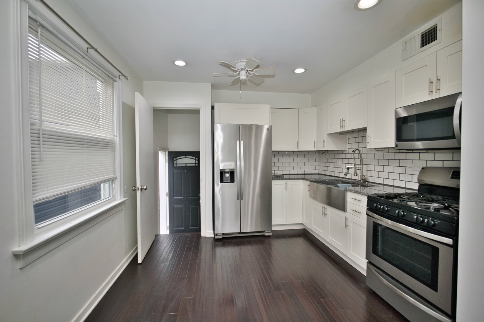 4122 Clinton Avenue Stickney, IL 60402 - Photo 18 of 44 a kitchen with stainless steel appliances a refrigerator and a stove top oven