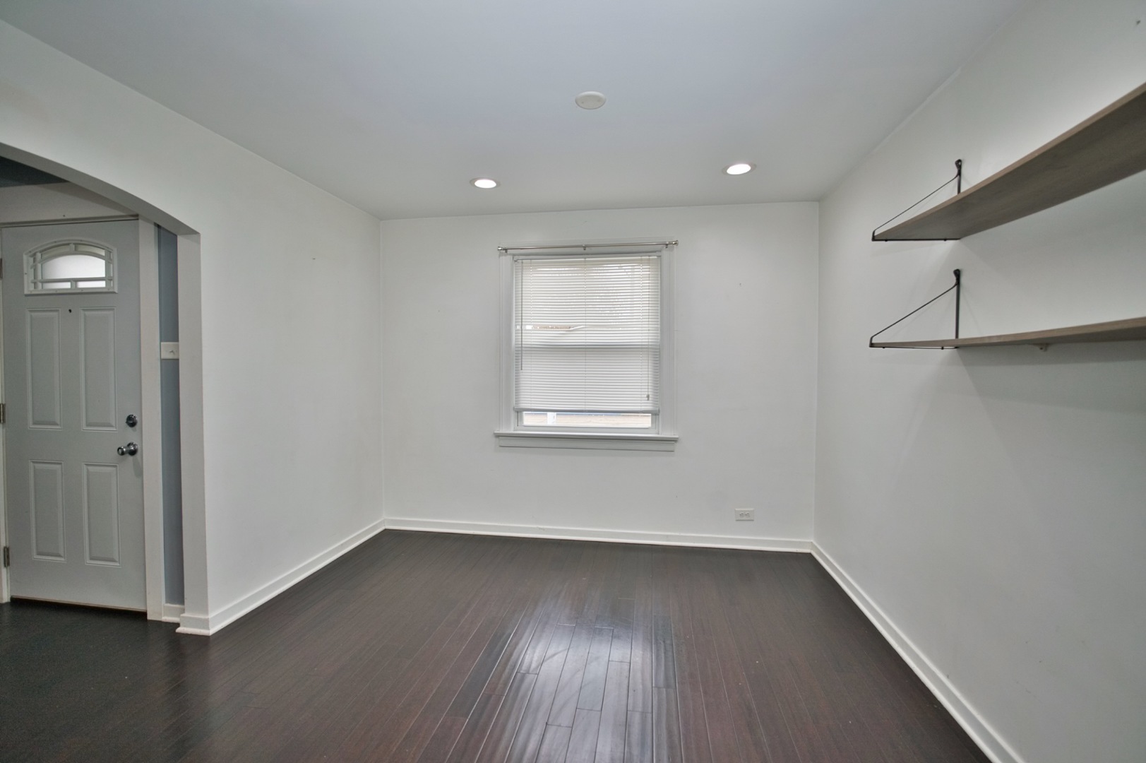 4122 Clinton Avenue Stickney, IL 60402 - Photo 19 of 44 an empty room with wooden floor and windows