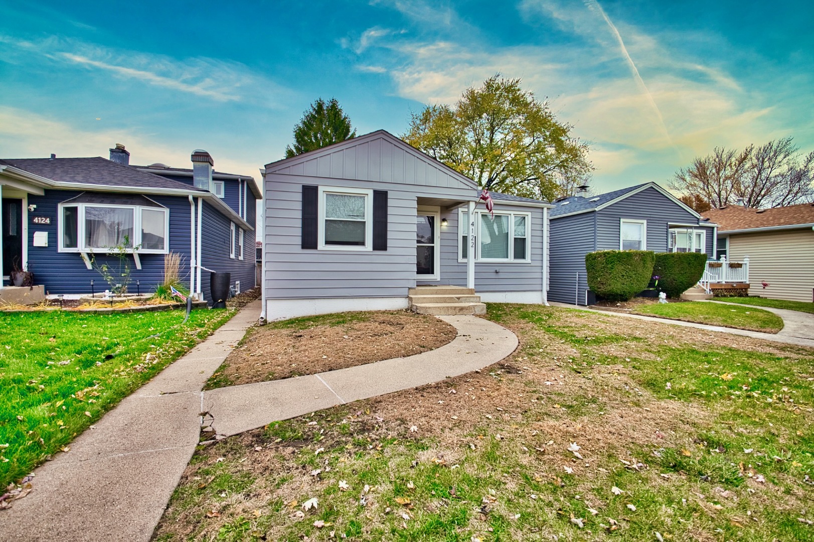 4122 Clinton Avenue Stickney, IL 60402 - Photo 3 of 44 a front view of a house with a yard and garage