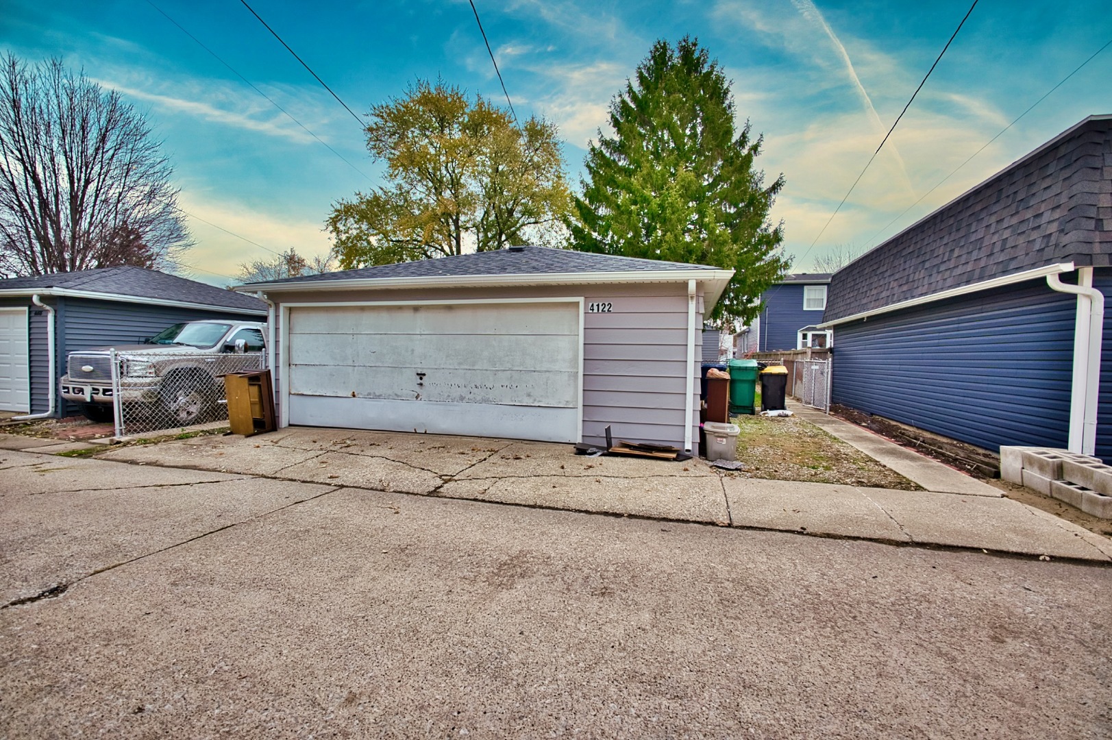 4122 Clinton Avenue Stickney, IL 60402 - Photo 41 of 44 a front view of a house with a yard and garage