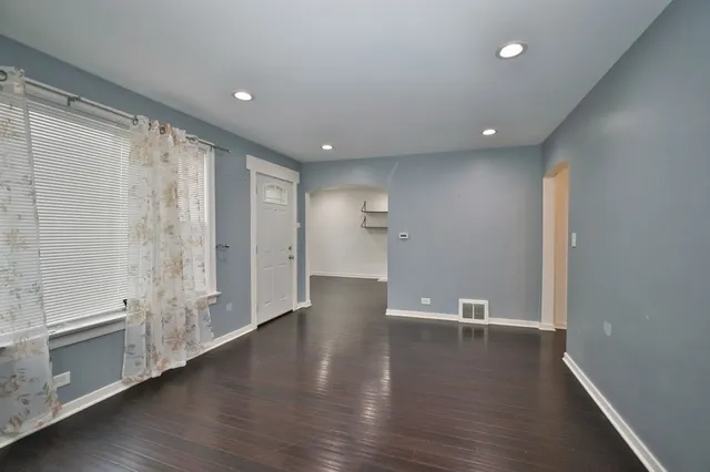 a view of a livingroom with wooden floor