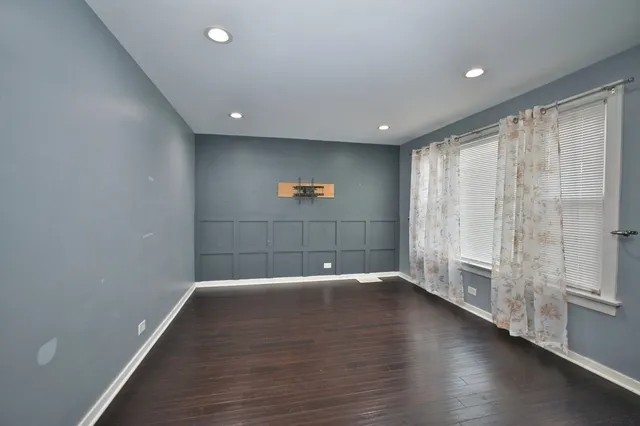 a view of a livingroom with wooden floor
