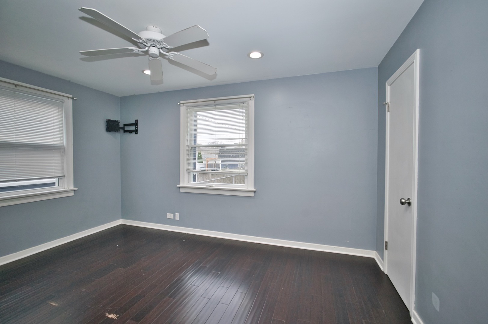 4122 Clinton Avenue Stickney, IL 60402 - Photo 8 of 44 an empty room with wooden floor and windows