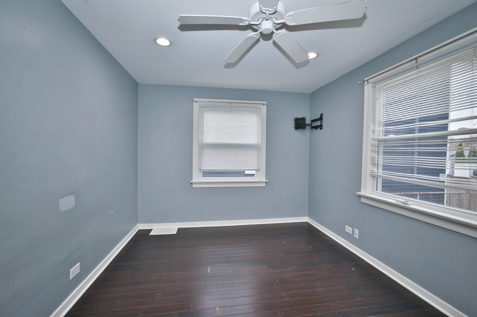 4122 Clinton Avenue Stickney, IL 60402 - Photo 9 of 44 a view of an empty room with wooden floor and a window