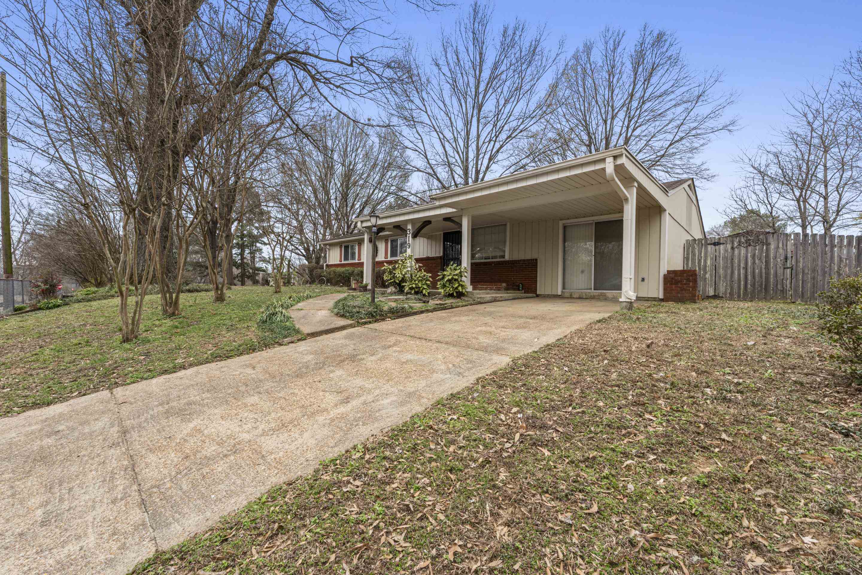 319 Homeville Road Collierville, TN 38017 - Photo 2 of 21 a view of a house with a yard and large tree