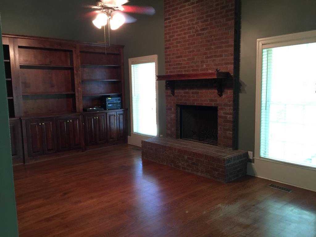 1257 Bass Road Macon, GA 31210 - Photo 5 of 13 a living room with furniture and a fireplace