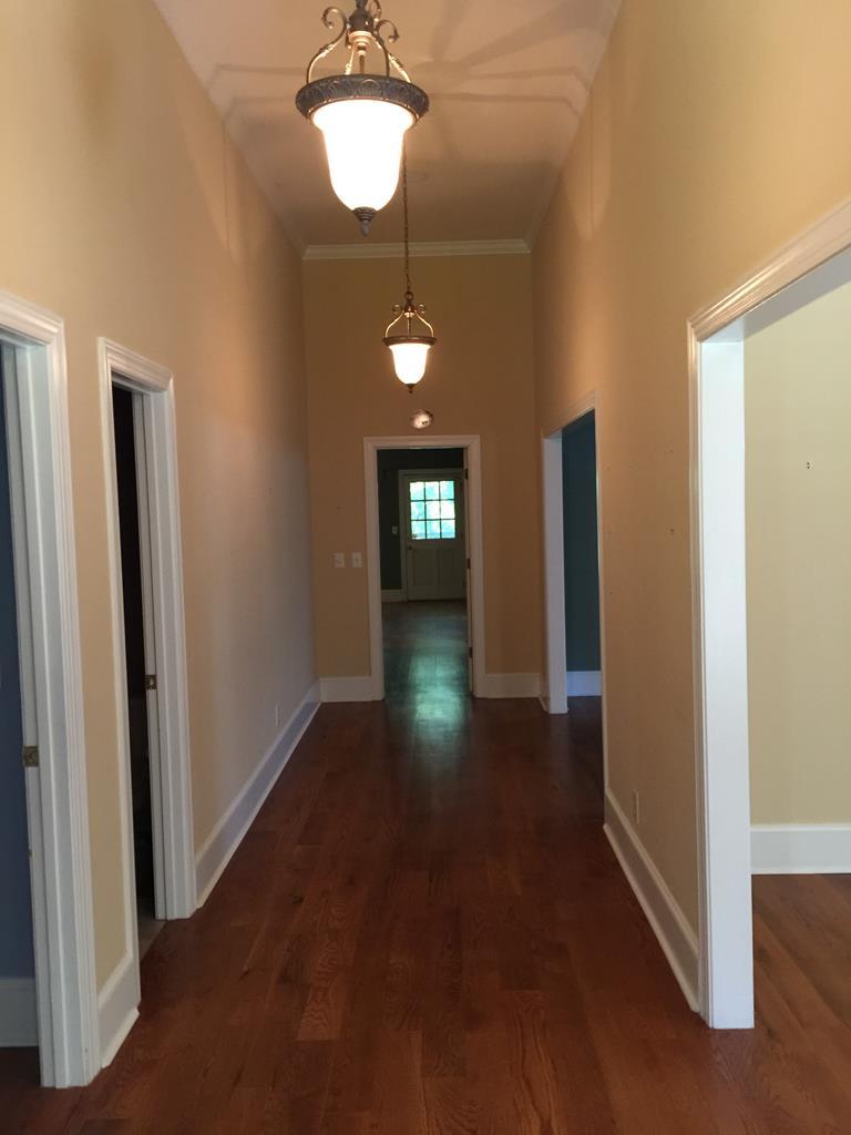 1257 Bass Road Macon, GA 31210 - Photo 6 of 13 a view of a hallway with windows and chandelier