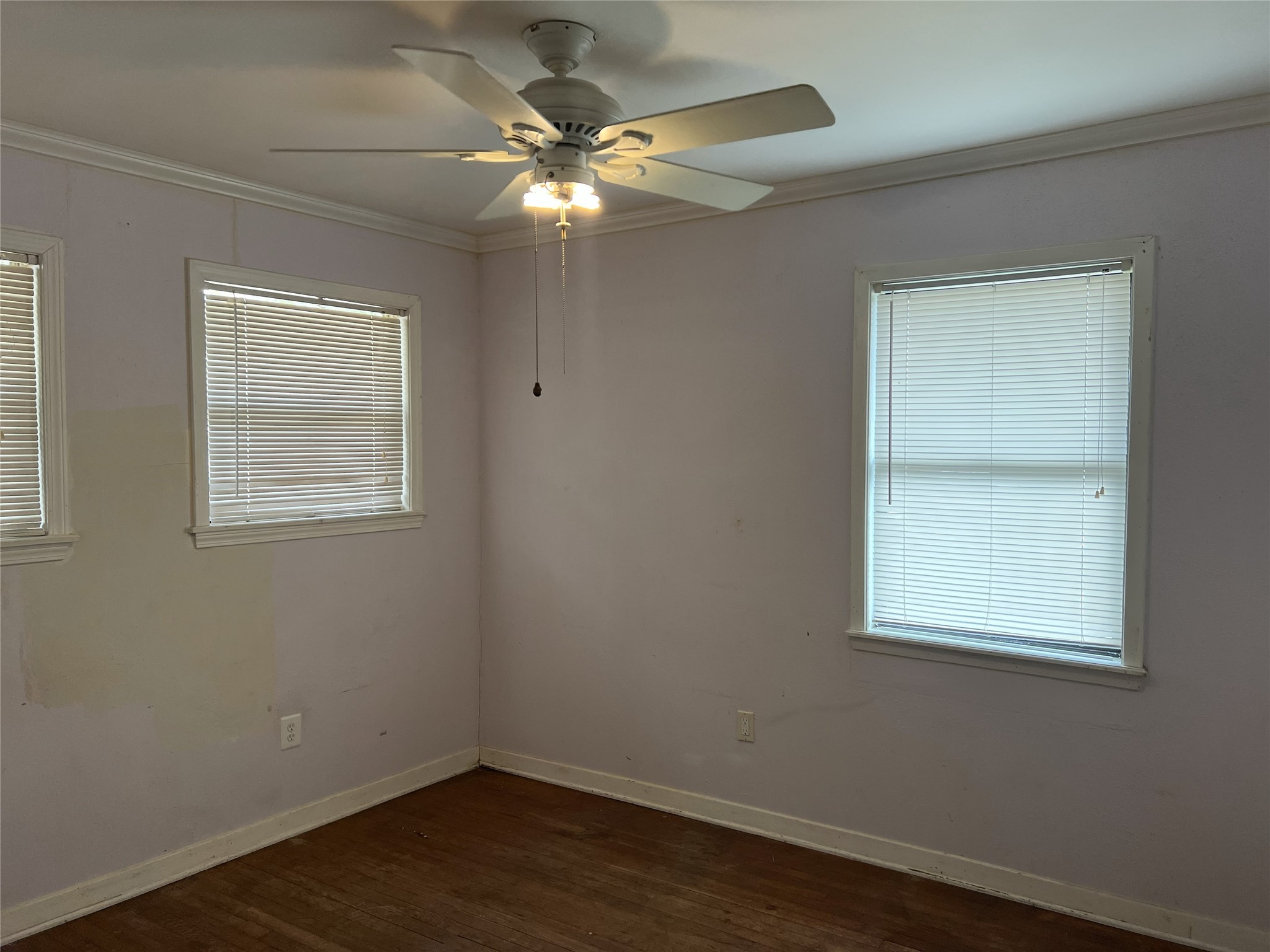 403 Wagers Street Conroe, TX 77301 - Photo 15 of 22 an empty room with wooden floor and windows