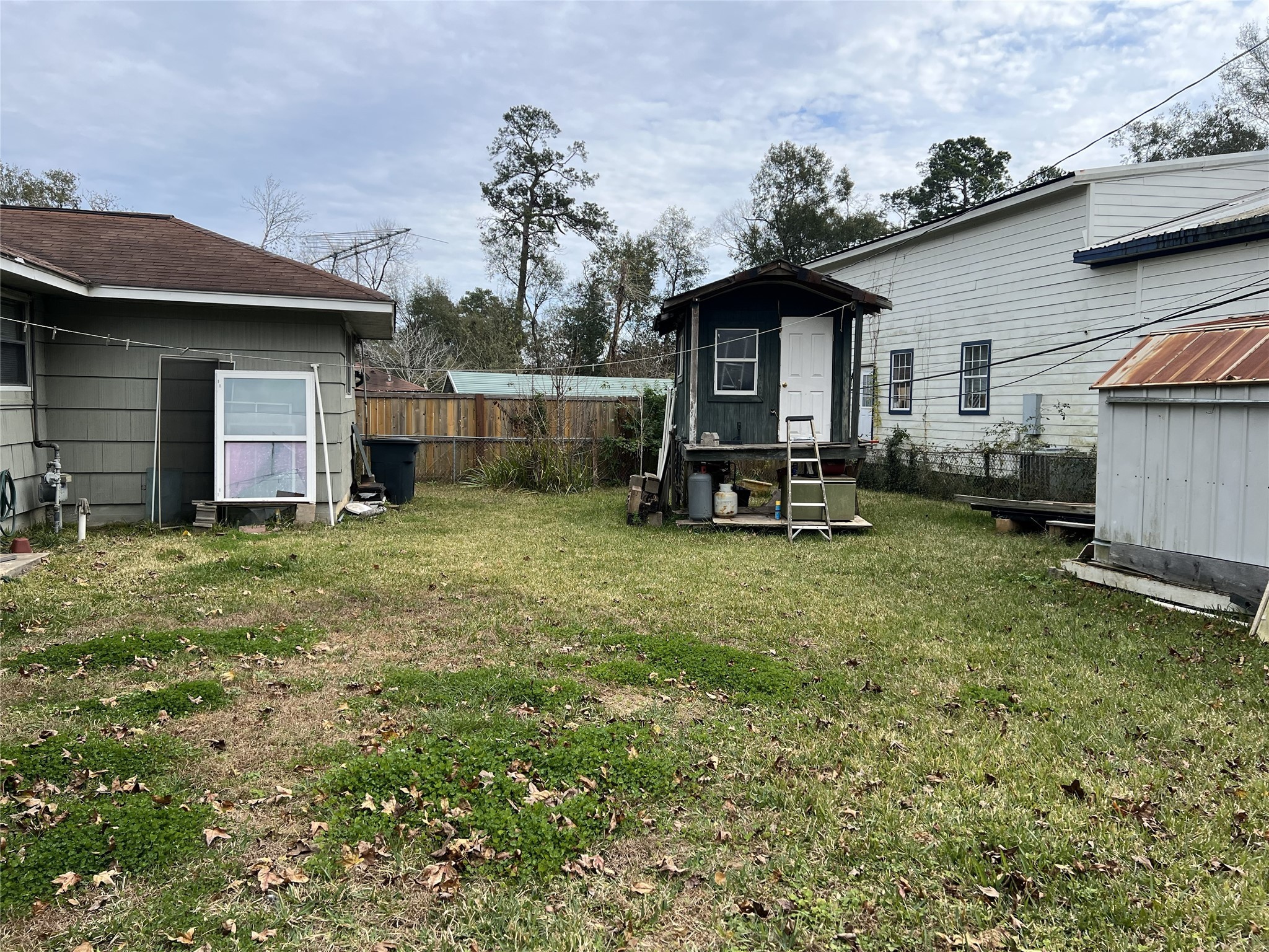 403 Wagers Street Conroe, TX 77301 - Photo 22 of 22 a view of a house with backyard and sitting area