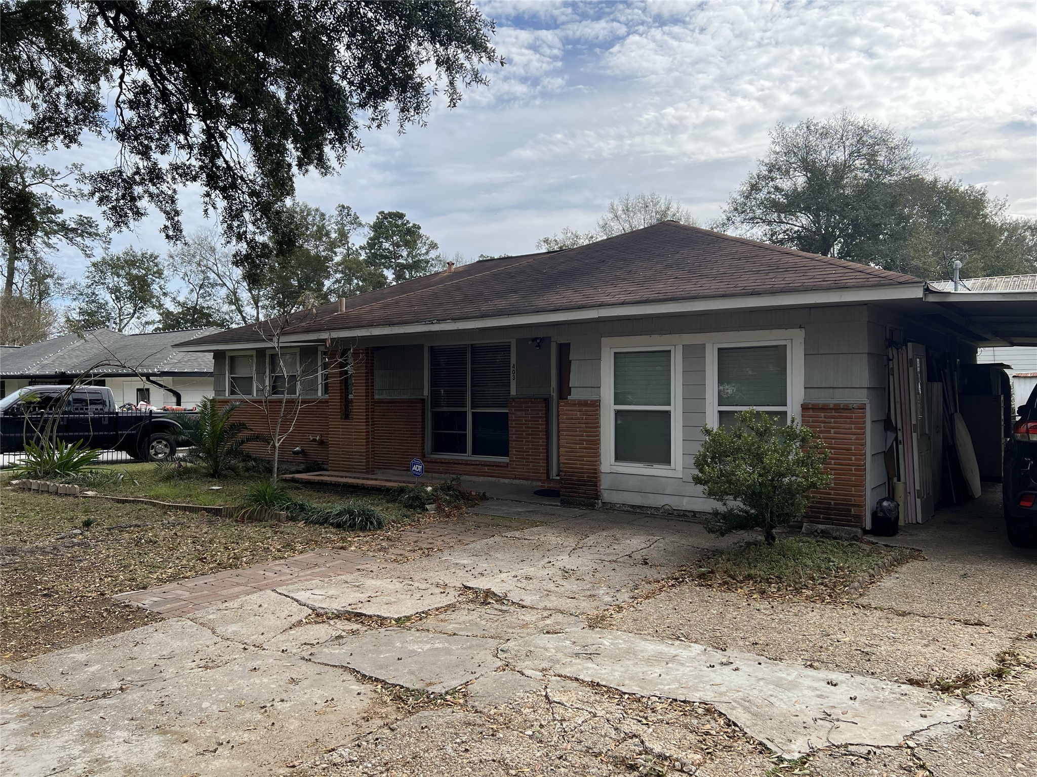403 Wagers Street Conroe, TX 77301 - Photo 4 of 22 a front view of a house with garden