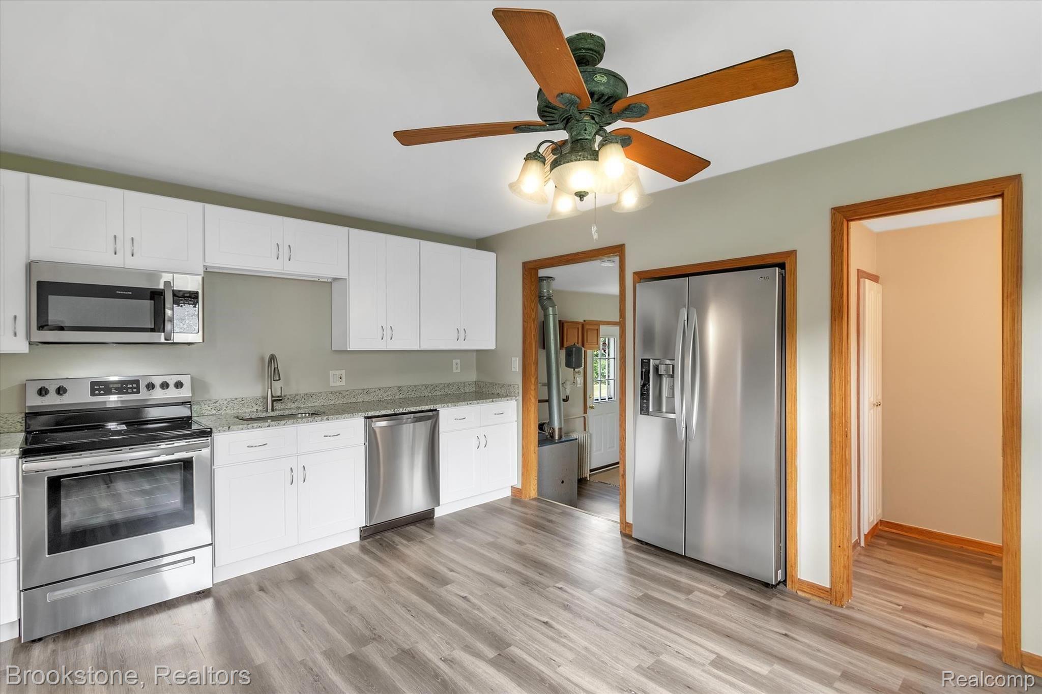 Gorgeous kitchen w/ luxury vinyl flooring.
