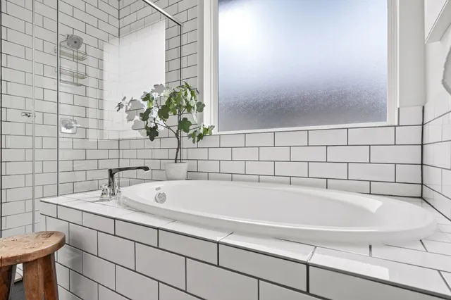 a bathroom with a bathtub and sink