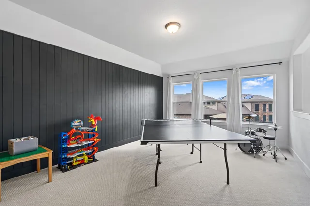 a living room with furniture and a table