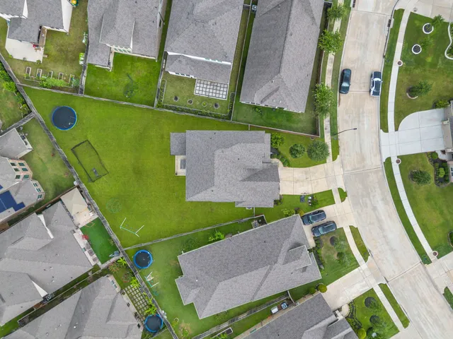 an aerial view of a house with a garden and plants