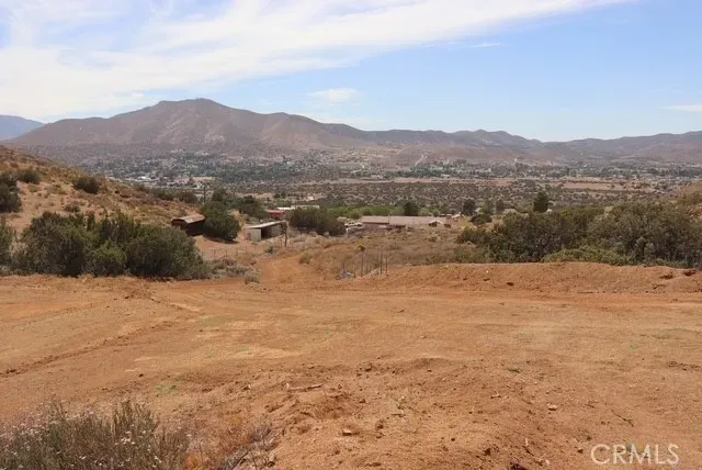 a view of a large mountain with mountains in the background