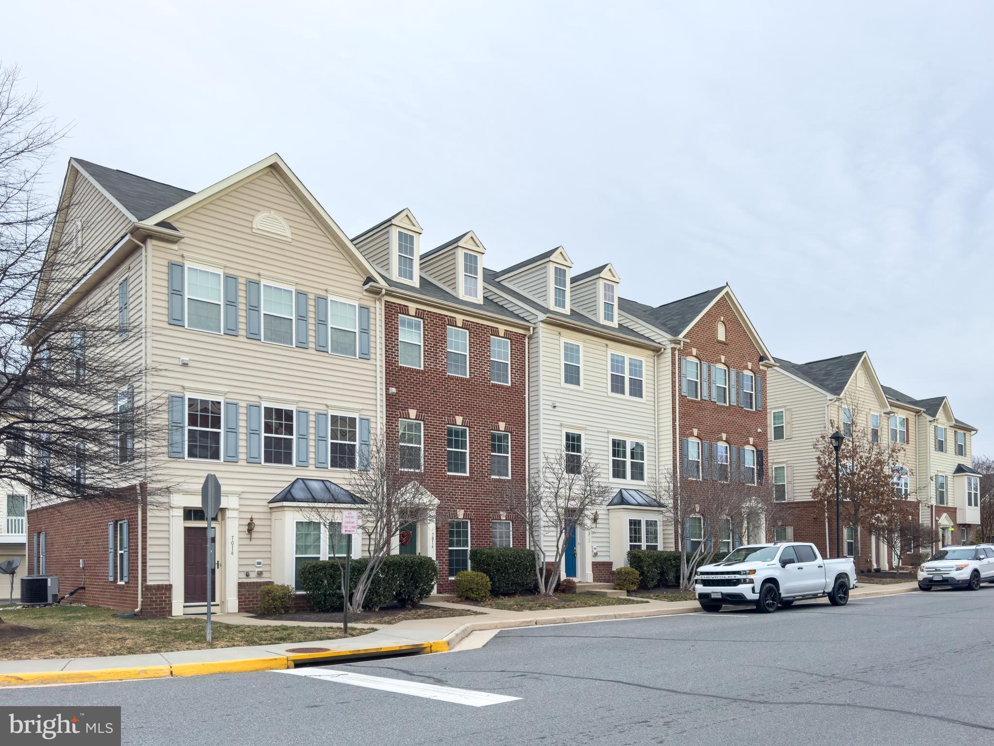 7012 Trek Way Gainesville, VA 20155 - Photo 33 of 33 a car parked in front of a brick building