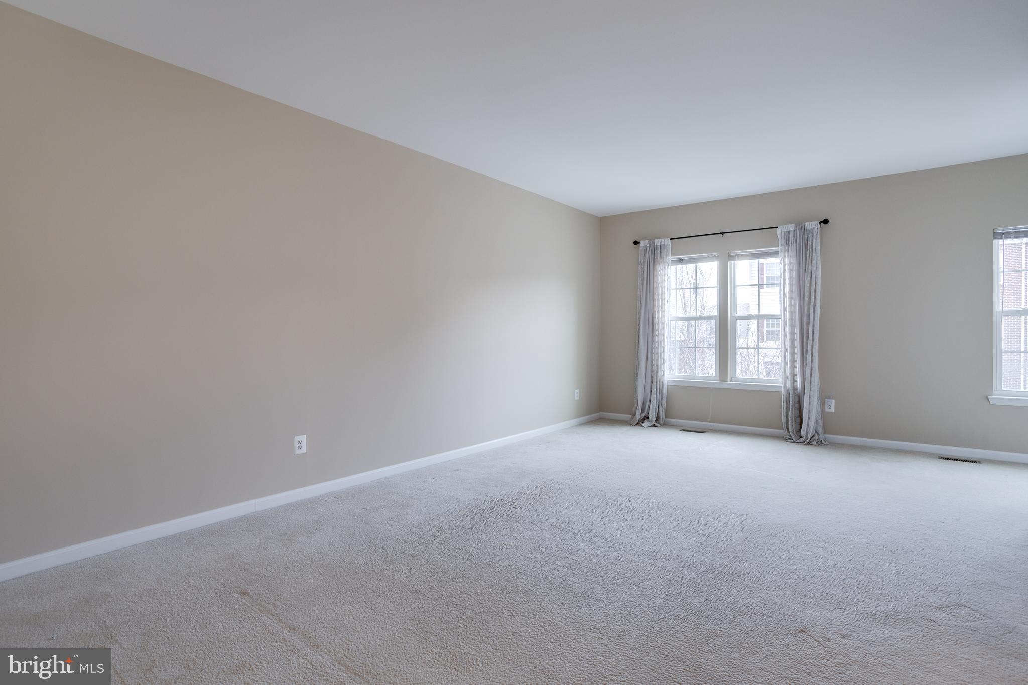 7012 Trek Way Gainesville, VA 20155 - Photo 10 of 33 a view of an empty room with a window