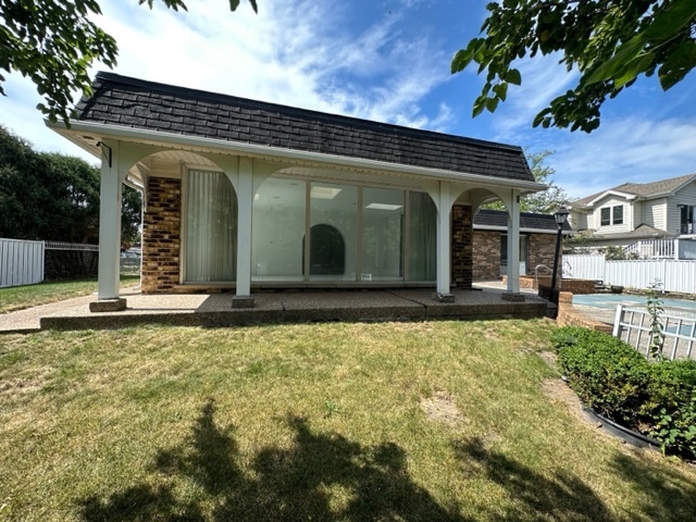 2647 Salceda Drive Northbrook, IL 60062 - Photo 3 of 19 a view of a brick house with large windows