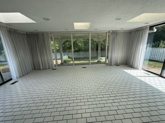 2647 Salceda Drive Northbrook, IL 60062 - Photo 8 of 19 a living room with a large window and furniture
