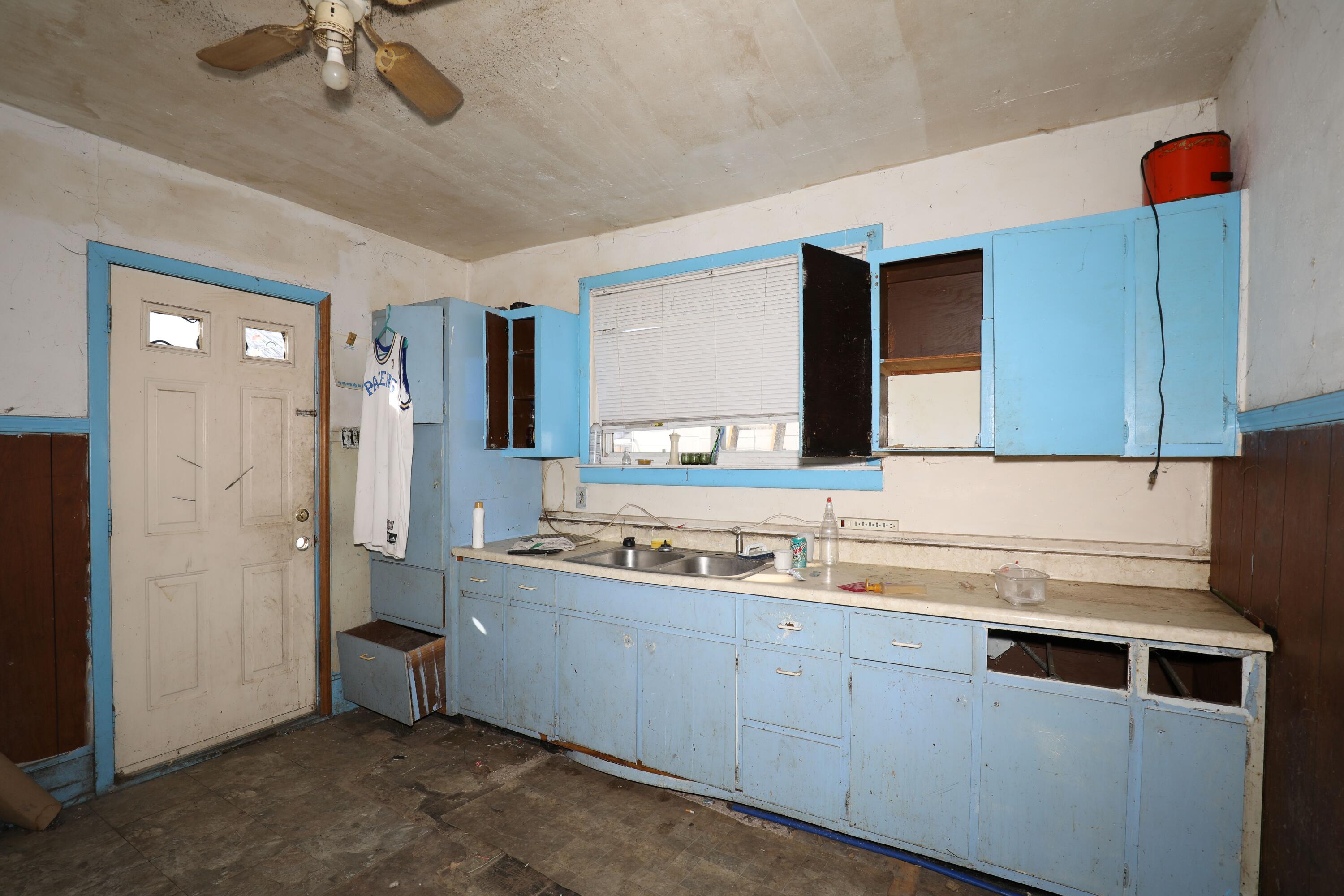 1615 West 1st Street Marion, IN 46952 - Photo 15 of 42 a kitchen with a sink and cabinets