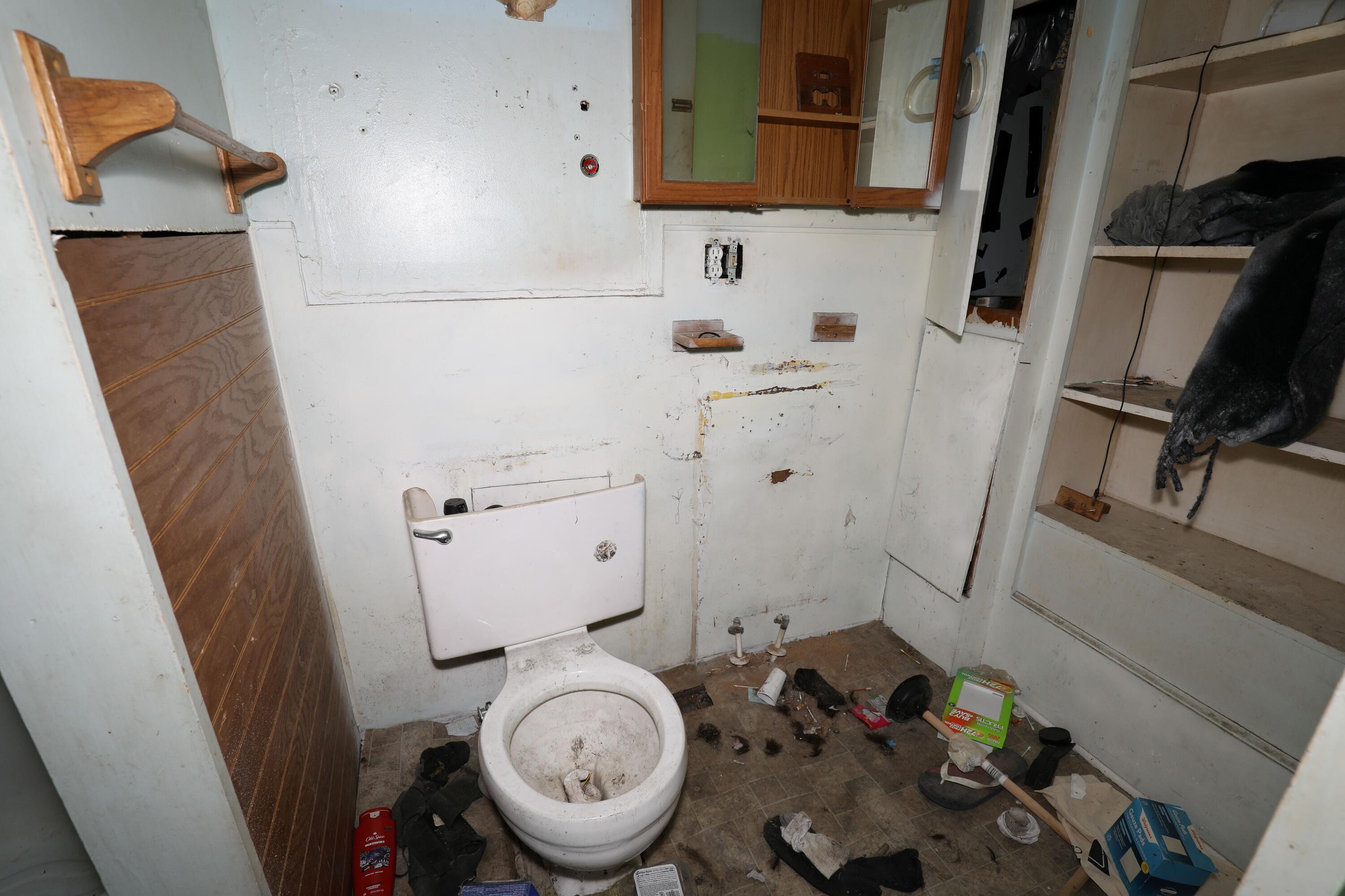 1615 West 1st Street Marion, IN 46952 - Photo 21 of 42 a bathroom with a sink and toilet