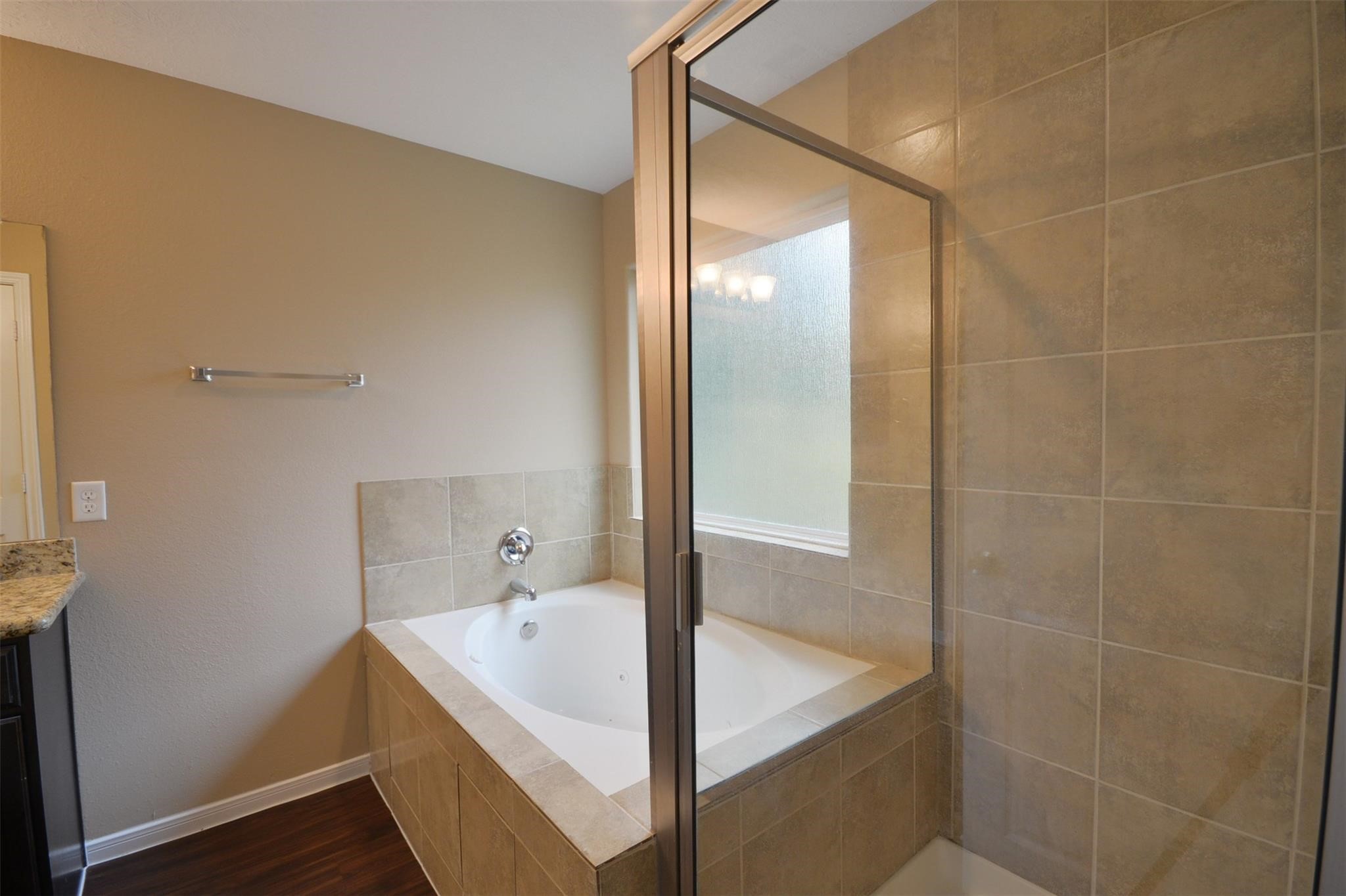 106 Eddy Street, Unit B Humble, TX 77338 - Photo 12 of 22 a bathroom with a tub and shower