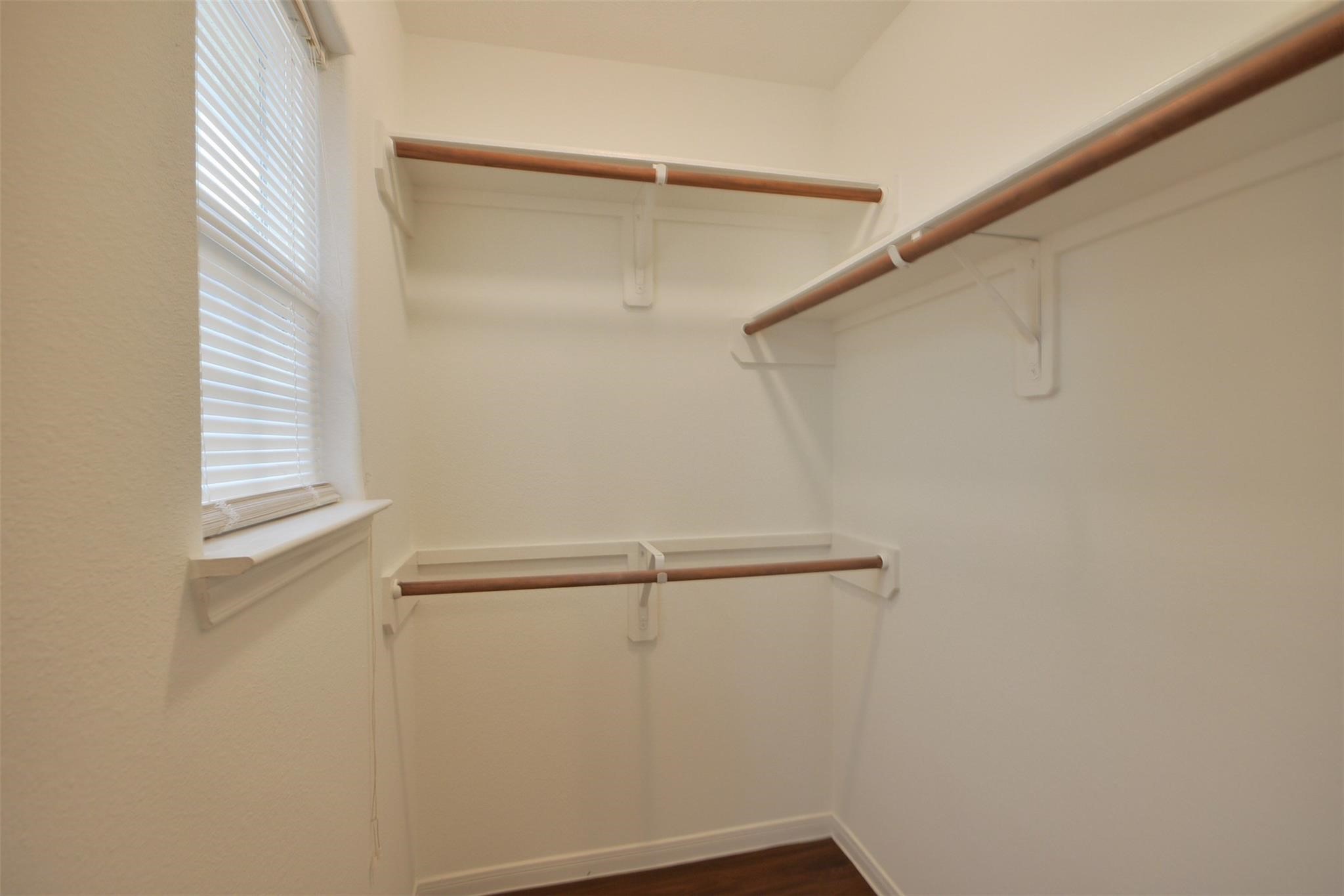 106 Eddy Street, Unit B Humble, TX 77338 - Photo 18 of 22 a view of an empty walk in closet