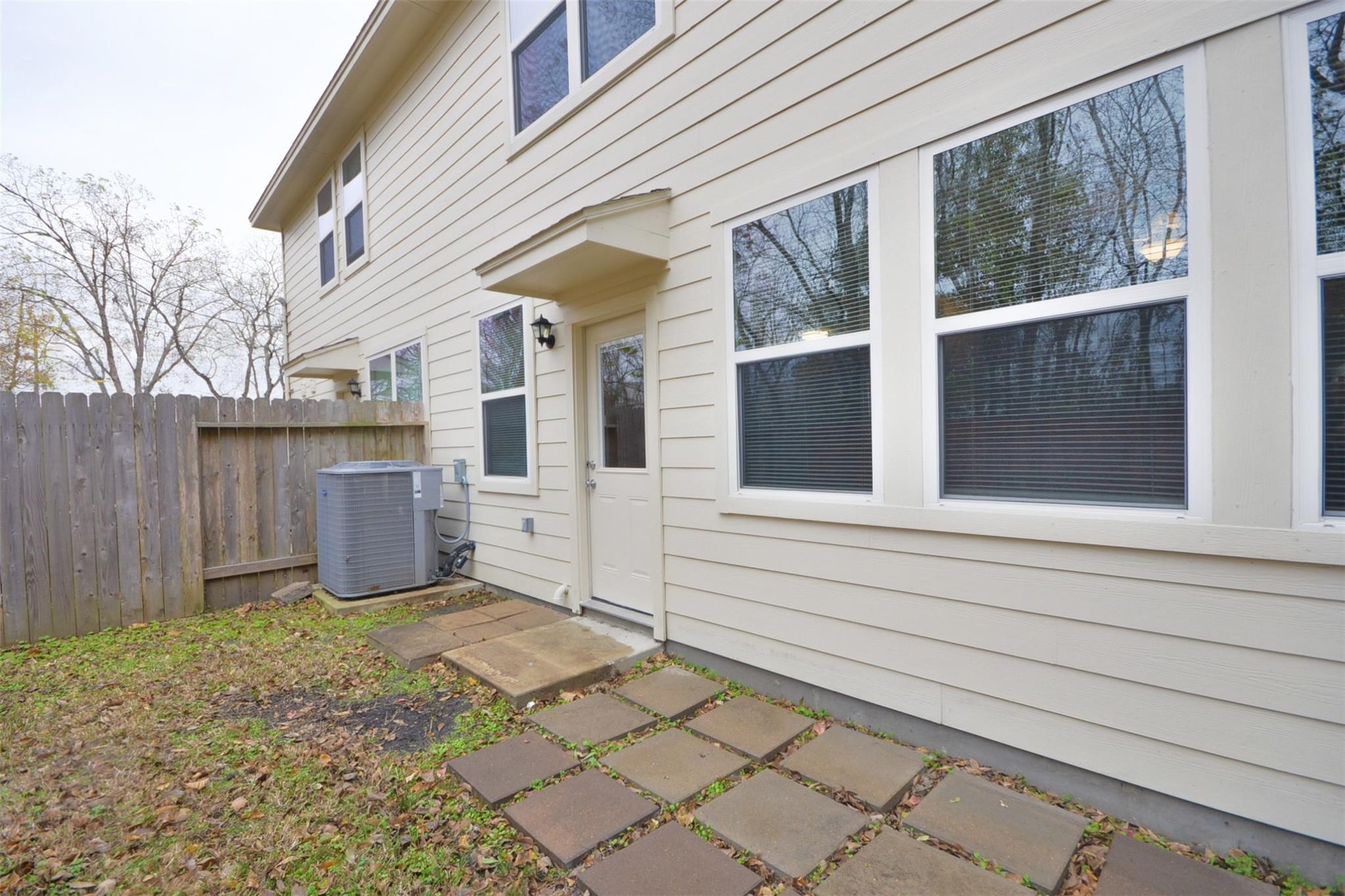106 Eddy Street, Unit B Humble, TX 77338 - Photo 22 of 22 a view of a house with a yard