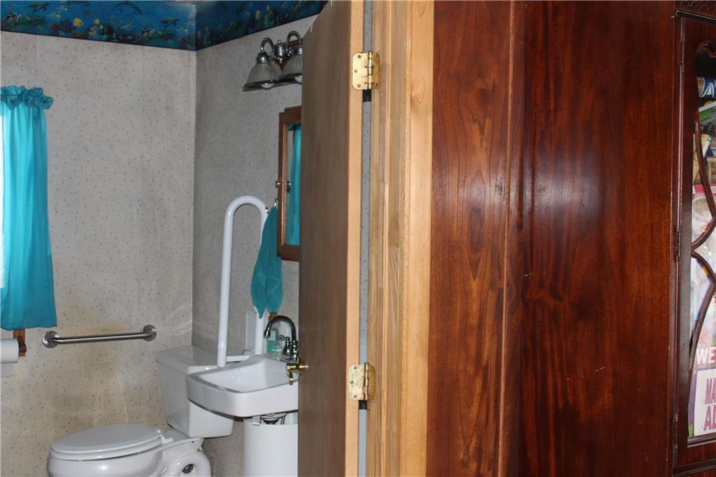 567 Klein Road Sandy Lake, PA 16145 - Photo 16 of 27 a bathroom with a shower and a toilet