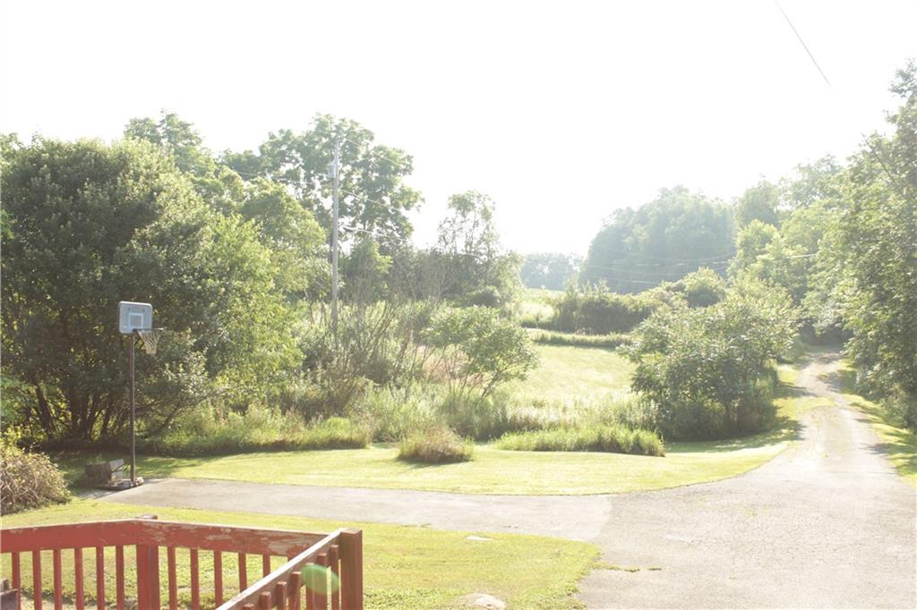 567 Klein Road Sandy Lake, PA 16145 - Photo 26 of 27 a view of yard with swimming pool and trees
