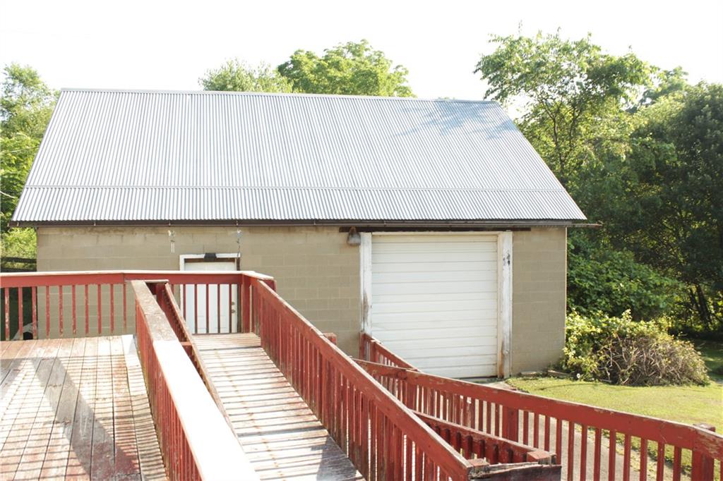 567 Klein Road Sandy Lake, PA 16145 - Photo 27 of 27 a view of balcony with wooden floor and outdoor seating