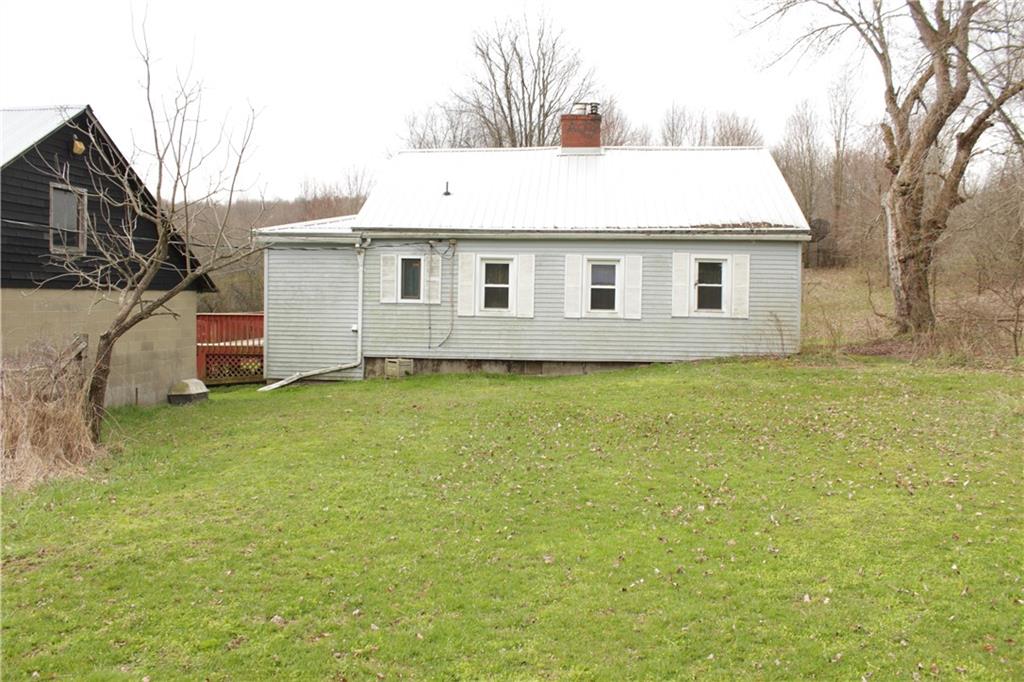 567 Klein Road Sandy Lake, PA 16145 - Photo 3 of 27 a house that has a big yard with wooden fence