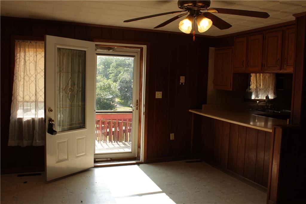567 Klein Road Sandy Lake, PA 16145 - Photo 8 of 27 a view of an empty room with a window