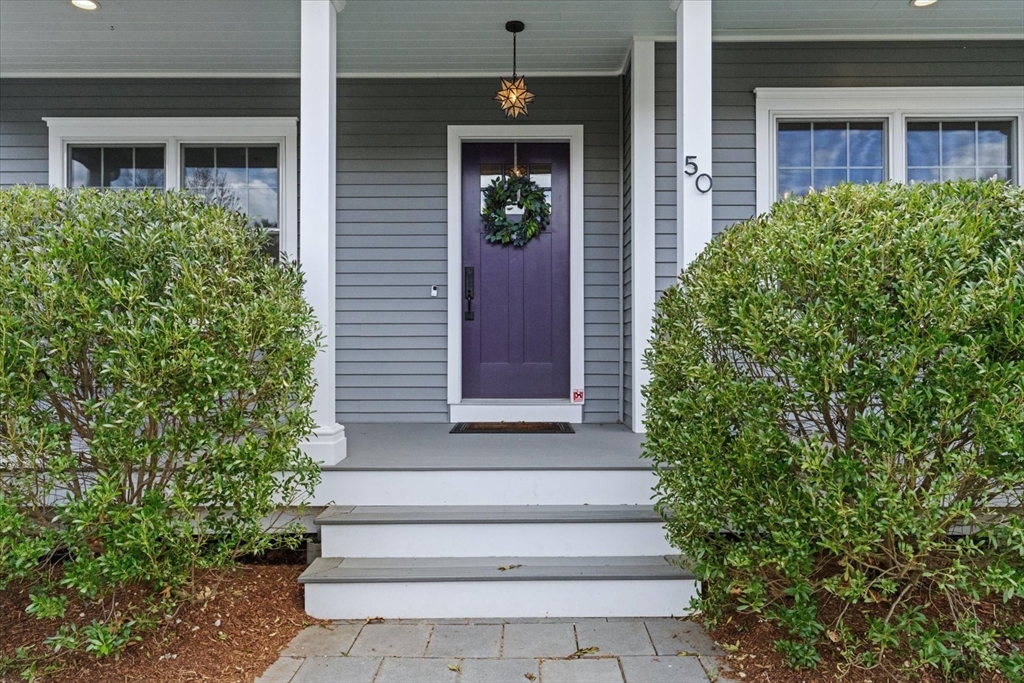 50 Quabbin Path Sutton, MA 01590 - Photo 5 of 42 a front view of a house with a yard