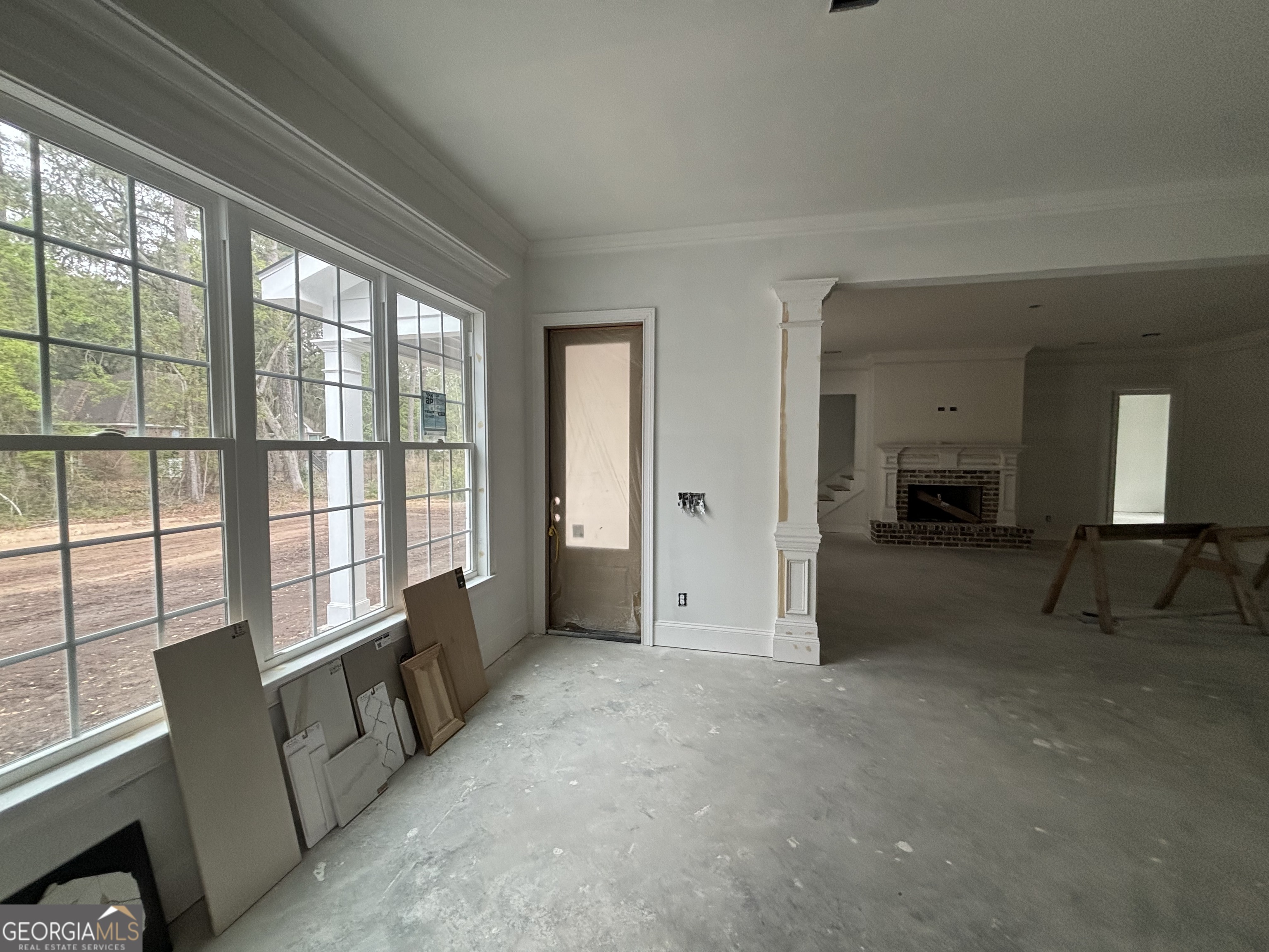 119 Hampton Point Drive St. Simons Island, GA 31522 - Photo 8 of 37 a living room with furniture and a large window