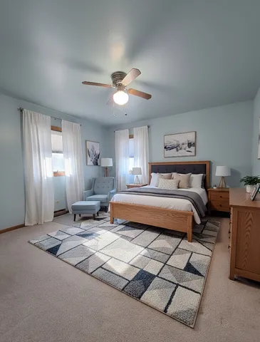 a bedroom with a bed gym equipment and a window