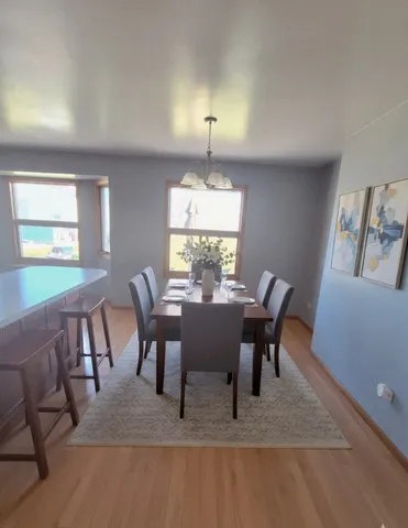 a view of a dining room with furniture window and outside view