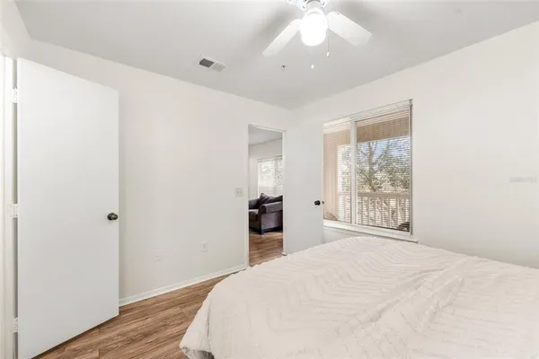 a bedroom with a large bed and a window